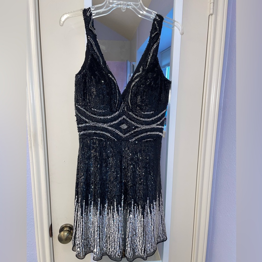 Black and silver sequin plunge neckline mini dress by Paris line size 6